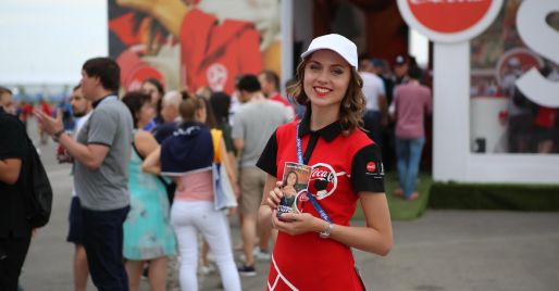 Promotional staff in the Coca-Cola photo zone for creating personalized cups at the FIFA World Cup 2018